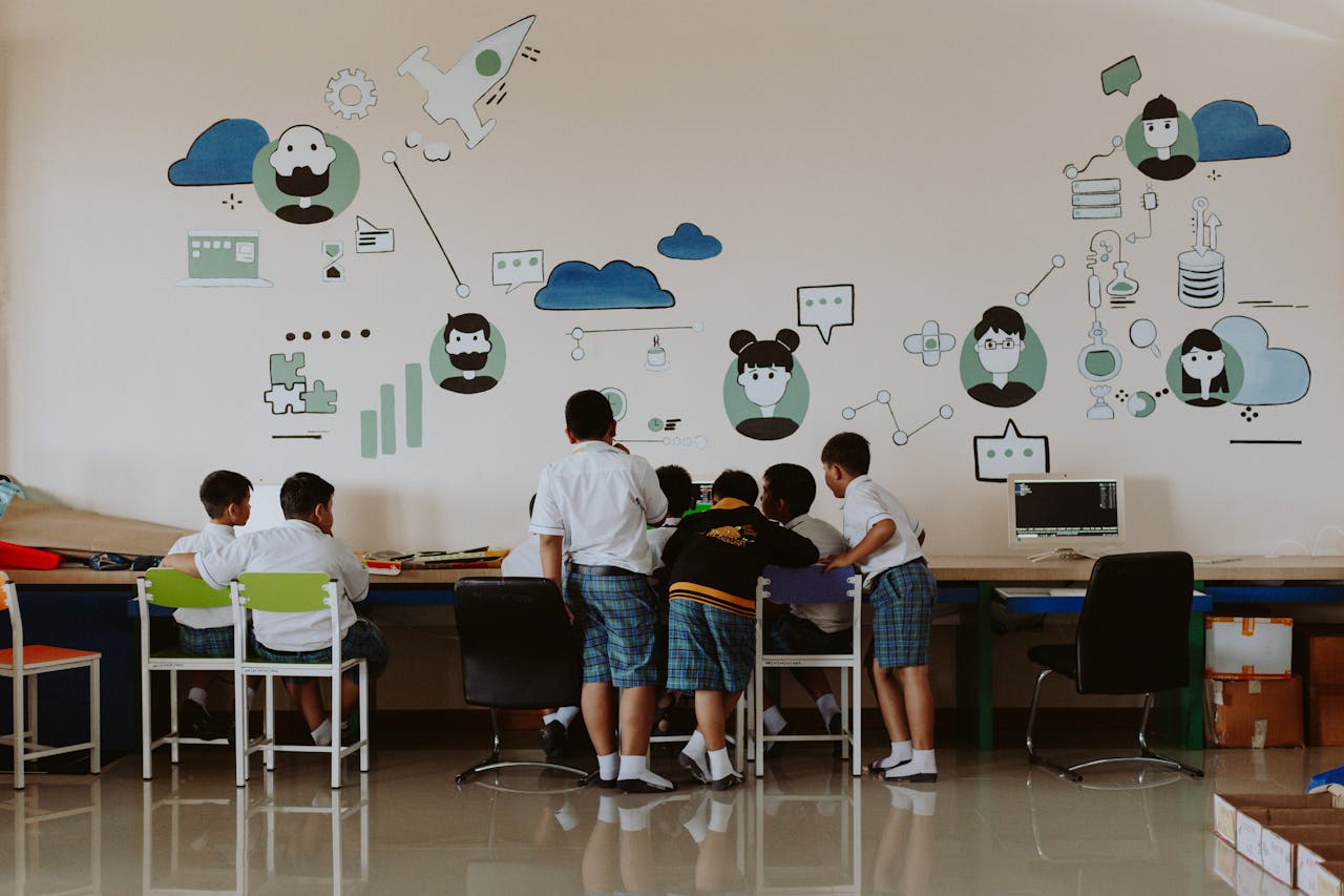 Students exploring technology in a colorful classroom environment, fostering education.